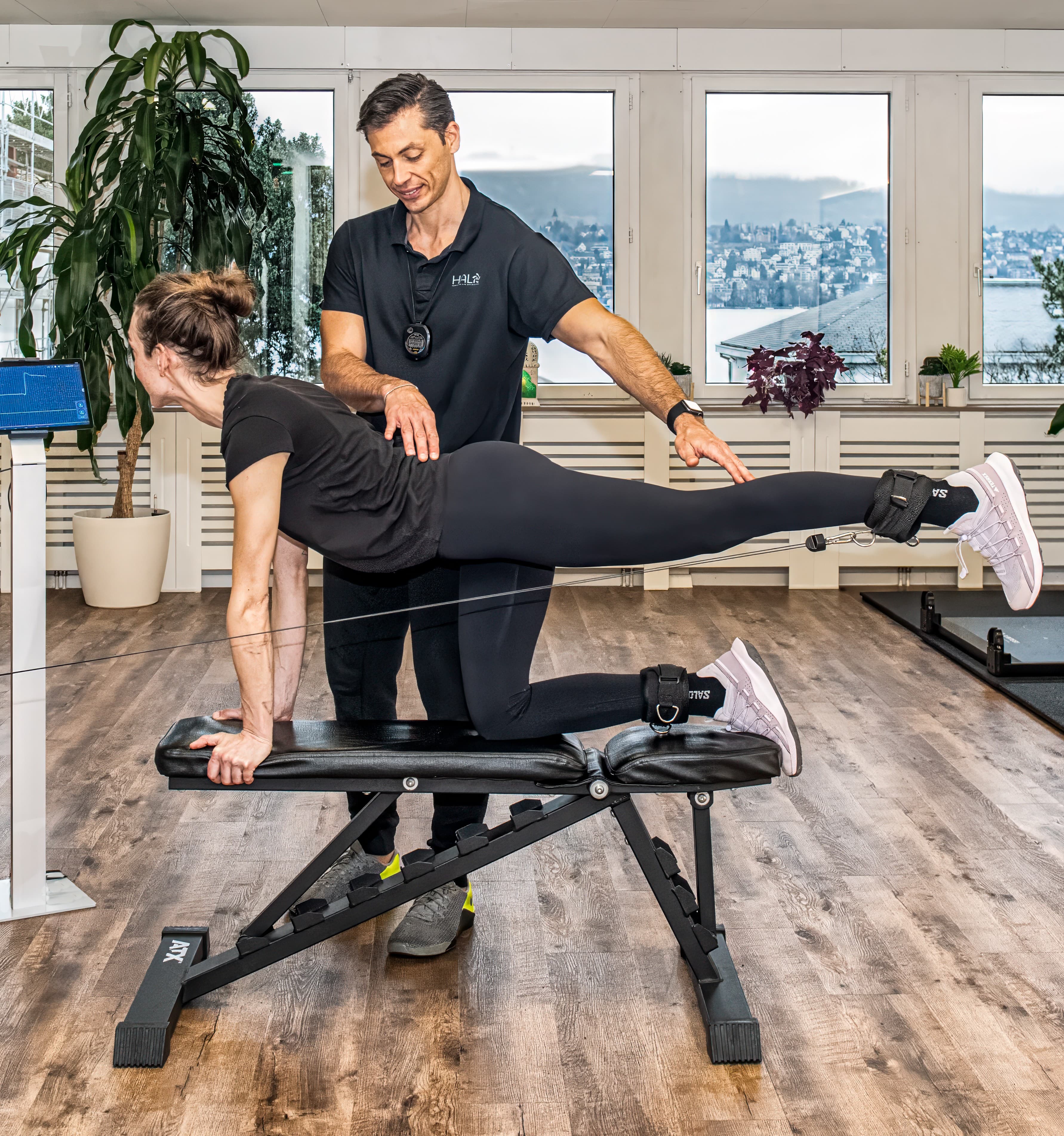 Physiotherapist performing rehabilitation on a patient.